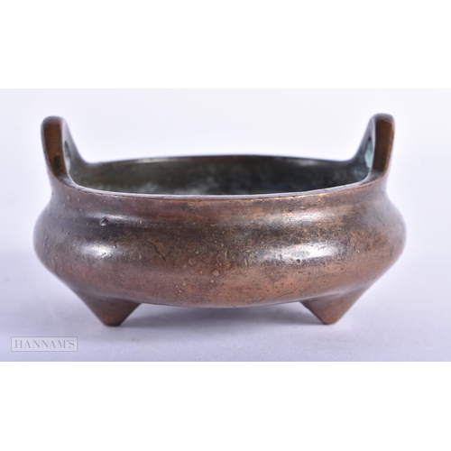 172 - A CHINESE TWIN HANDLED BRONZE CENSER. 311 grams. 8 cm wide.