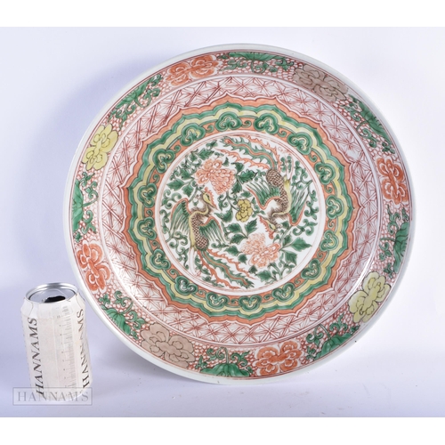 177 - A LARGE 19TH CENTURY CHINESE WUCAI PORCELAIN DISH bearing Kangxi marks to base. 34 cm diameter.