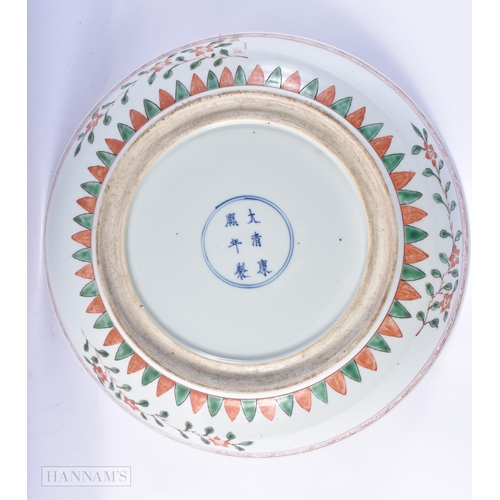 177 - A LARGE 19TH CENTURY CHINESE WUCAI PORCELAIN DISH bearing Kangxi marks to base. 34 cm diameter.