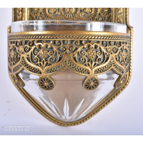 193 - A 19TH CENTURY CONTINENTAL GILT METAL FILIGREE FONT inset with a porcelain plaque, painted with the ... 