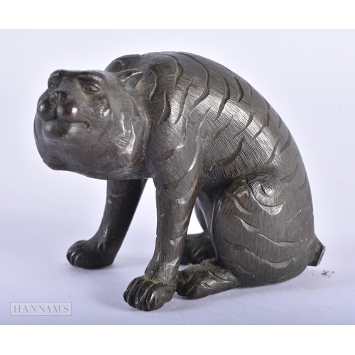 199 - A 19TH CENTURY JAPANESE MEIJI PERIOD BRONZE OKIMONO modelled as a tiger. 8 cm x 8 cm.