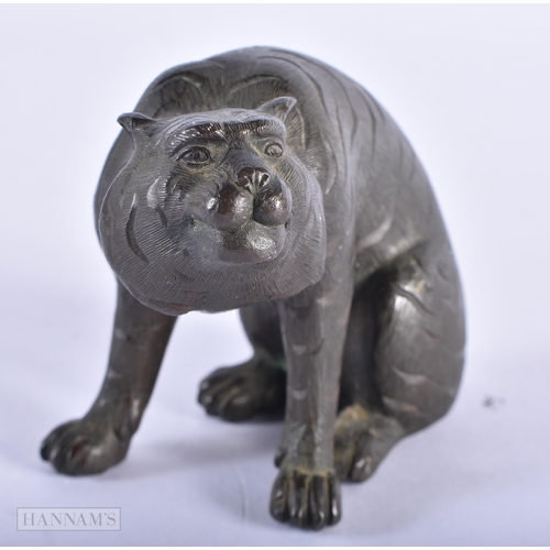 199 - A 19TH CENTURY JAPANESE MEIJI PERIOD BRONZE OKIMONO modelled as a tiger. 8 cm x 8 cm.