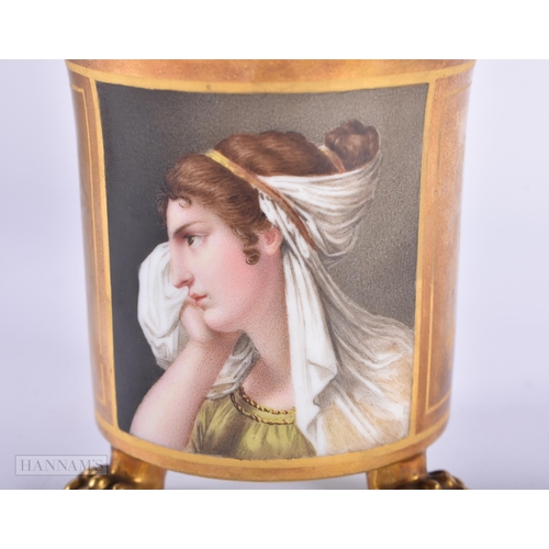 202 - AN EARLY 19TH CENTURY FRENCH EMPIRE PORCELAIN CUP AND SAUCER painted with a portrait. (2)