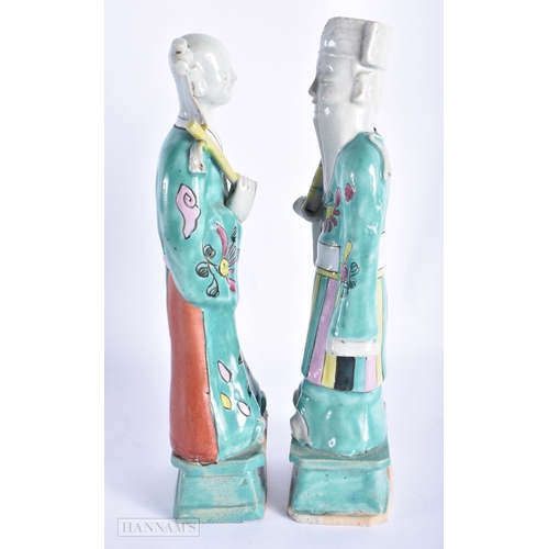 203 - A PAIR OF EARLY 19TH CENTURY CHINESE FAMILLE ROSE PORCELAIN FIGURES Jiaqing. 22cm high.