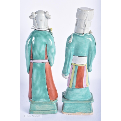 203 - A PAIR OF EARLY 19TH CENTURY CHINESE FAMILLE ROSE PORCELAIN FIGURES Jiaqing. 22cm high.