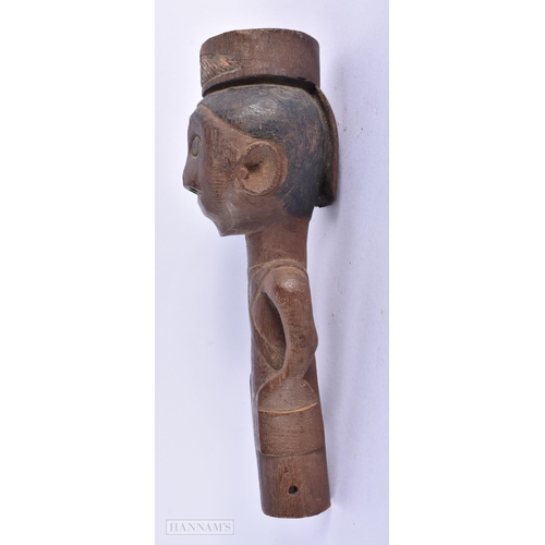 211 - AN ANTIQUE AFRICAN TRIBAL CARVED WOOD STAFF TIP formed as a figure. 15cm high.