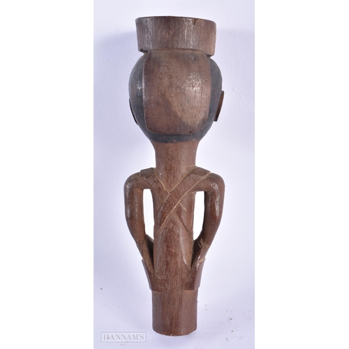 211 - AN ANTIQUE AFRICAN TRIBAL CARVED WOOD STAFF TIP formed as a figure. 15cm high.