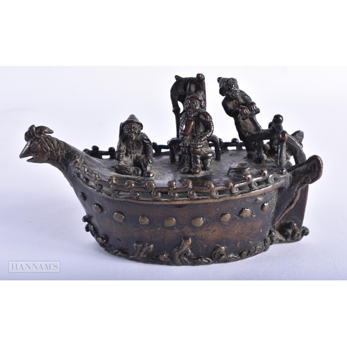 213 - A 19TH CENTURY JAPANESE MEIJI PERIOD BRONZE OKIMONO modelled with figures upon a boat. 13 cm wide.