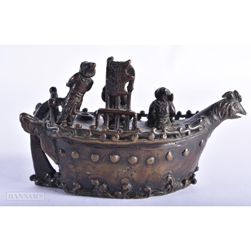 213 - A 19TH CENTURY JAPANESE MEIJI PERIOD BRONZE OKIMONO modelled with figures upon a boat. 13 cm wide.