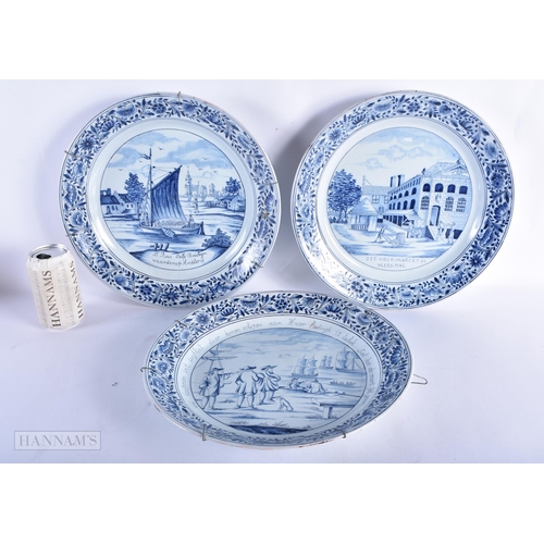 218 - A LARGE SET OF THREE DUTCH DELFT BLUE AND WHITE DISHES painted with boats and landscapes. 32 cm diam... 