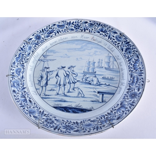 218 - A LARGE SET OF THREE DUTCH DELFT BLUE AND WHITE DISHES painted with boats and landscapes. 32 cm diam... 