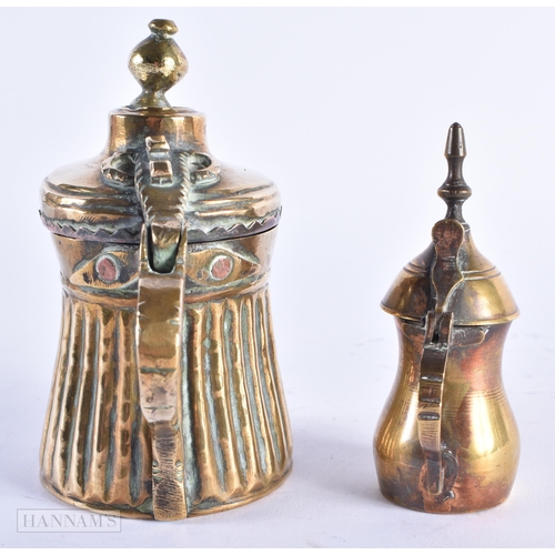 22 - TWO 19TH CENTURY PERSIAN ISLAMIC MIDDLE EASTERN EWERS. Largest 12 cm x 12 cm. (2)