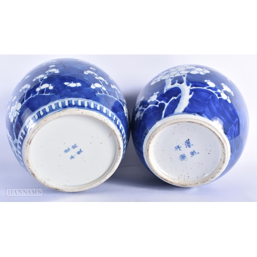 220 - TWO 19TH CENTURY CHINESE BLUE AND WHITE PORCELAIN GINGER JARS bearing Kangxi marks to base. Largest ... 