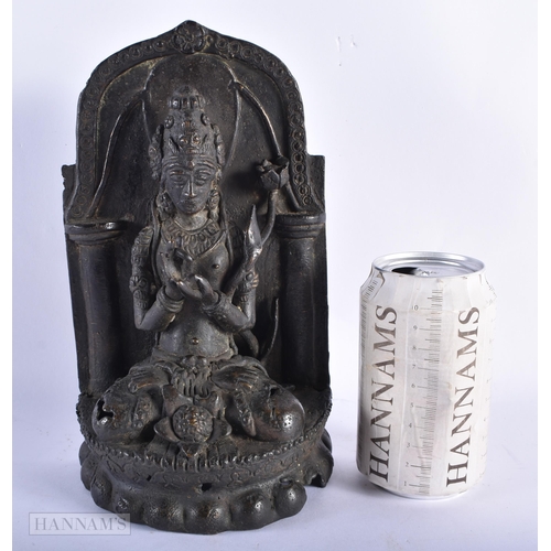 225 - A 17TH/18TH CENTURY INDIAN NEPALESE BRONZE BUDDHA SHRINE formed with a figure upon a lotus. 25 cm x ... 