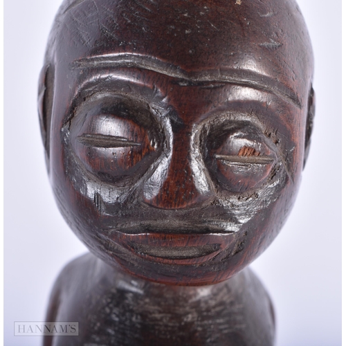 226 - AN ANTIQUE BAVARIAN BLACK FOREST CARVED WOOD OWL together with an African tribal figure. Largest 36 ... 