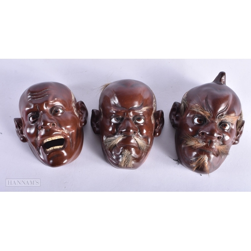 235 - THREE 19TH CENTURY JAPANESE MEIJI PERIOD LACQUERED MASKS. 12 cm x 8 cm. (3)