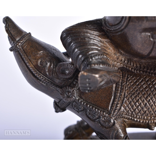 239 - A 19TH CENTURY INDIAN BRONZE FIGURE OF GANESHA modelled with attendants. 15cm high.