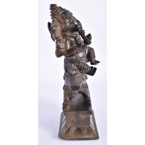 239 - A 19TH CENTURY INDIAN BRONZE FIGURE OF GANESHA modelled with attendants. 15cm high.