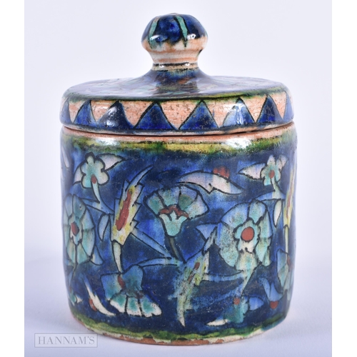 247 - A MIDDLE EASTERN IZNIK ISLAMIC POTTERY BOWL AND COVER. 12 cm high.