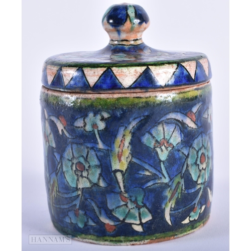 247 - A MIDDLE EASTERN IZNIK ISLAMIC POTTERY BOWL AND COVER. 12 cm high.