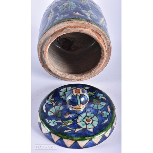 247 - A MIDDLE EASTERN IZNIK ISLAMIC POTTERY BOWL AND COVER. 12 cm high.