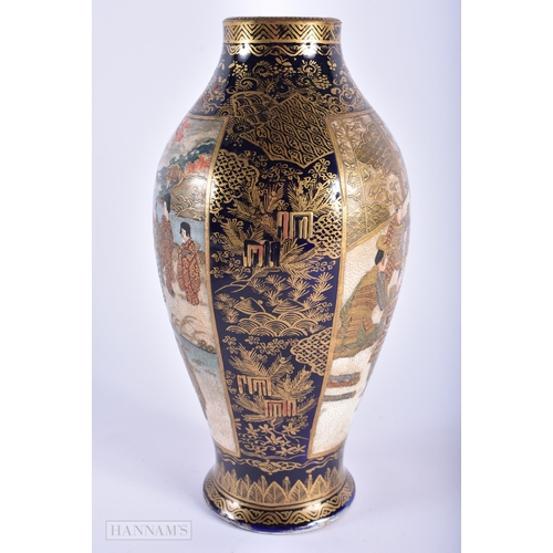 252 - A 19TH CENTURY JAPANESE MEIJI PERIOD SATSUMA VASE painted with geisha and other figures within lands... 