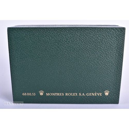 254 - A ROLEX WATCH BOX with papers. 15cm x 10 cm.