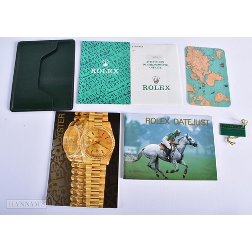 254 - A ROLEX WATCH BOX with papers. 15cm x 10 cm.