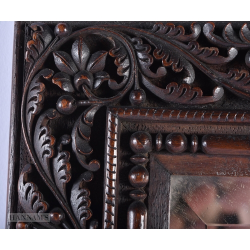 260 - A LARGE 19TH CENTURY ANGLO INDIAN COUNTRY HOUSE CARVED WOOD MIRROR formed with foliage and serpents.... 