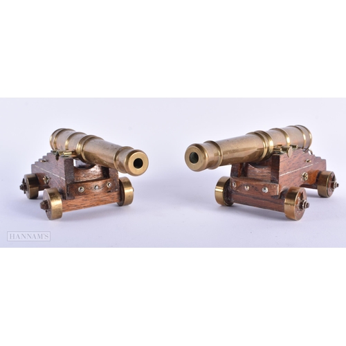 270 - A PAIR OF ANTIQUE GENTLEMAN'S BRONZE DESK CANNONS. 21 cm wide.