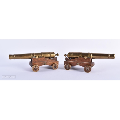 270 - A PAIR OF ANTIQUE GENTLEMAN'S BRONZE DESK CANNONS. 21 cm wide.