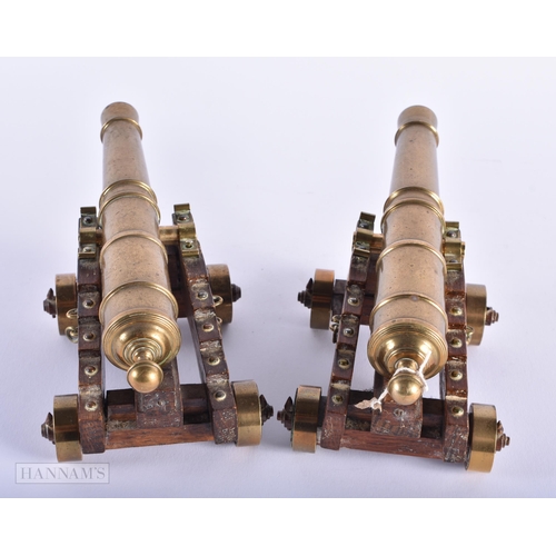 270 - A PAIR OF ANTIQUE GENTLEMAN'S BRONZE DESK CANNONS. 21 cm wide.