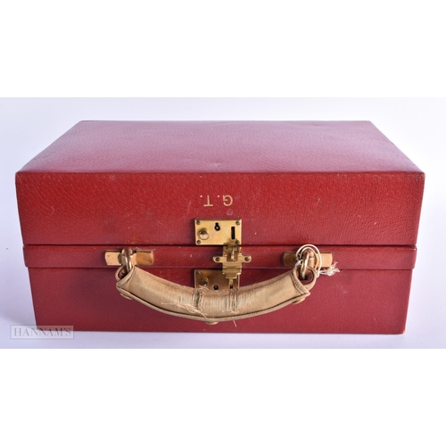 280 - A LOVELY ART DECO RED LEATHER CASED SILVER TRAVELLING BOX with fitted interior and silver mounted gl... 