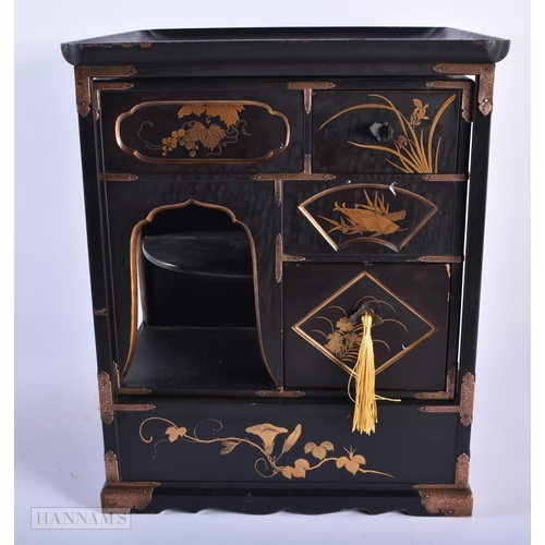 281 - A LATE 19TH CENTURY JAPANESE MEIJI PERIOD BLACK LACQUER CABINET decorated in gilt with birds and fol... 