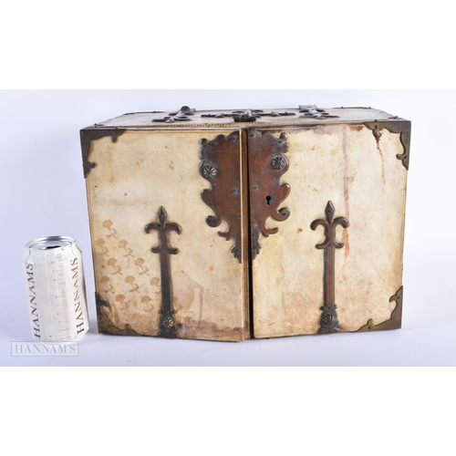 286 - AN ANTIQUE CONTINENTAL ANIMAL HIDE COPPER BOUND TABLE CABINET modelled in the 17th century manner. 2... 