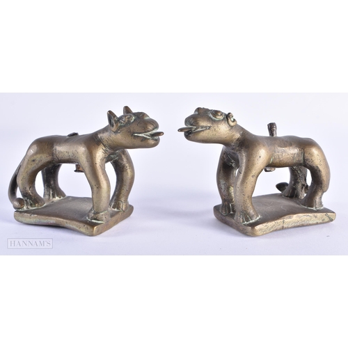 29 - A PAIR OF 17TH/18TH CENTURY INDIAN BRONZE FIGURES OF BEASTS modelled prowling. 12 cm x 8 cm.