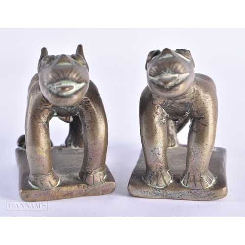 29 - A PAIR OF 17TH/18TH CENTURY INDIAN BRONZE FIGURES OF BEASTS modelled prowling. 12 cm x 8 cm.