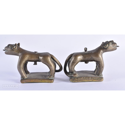 29 - A PAIR OF 17TH/18TH CENTURY INDIAN BRONZE FIGURES OF BEASTS modelled prowling. 12 cm x 8 cm.