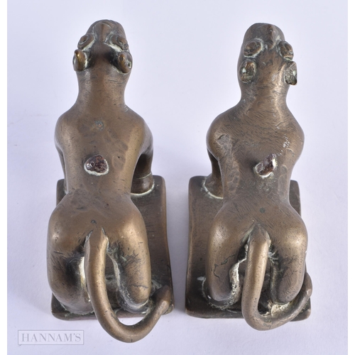 29 - A PAIR OF 17TH/18TH CENTURY INDIAN BRONZE FIGURES OF BEASTS modelled prowling. 12 cm x 8 cm.