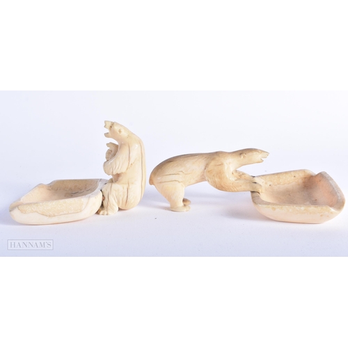 298 - AN ANTIQUE TRIBAL INUIT RAY SKIN CANOE together with two Inuit bone polar bear dishes. Largest 57 cm... 