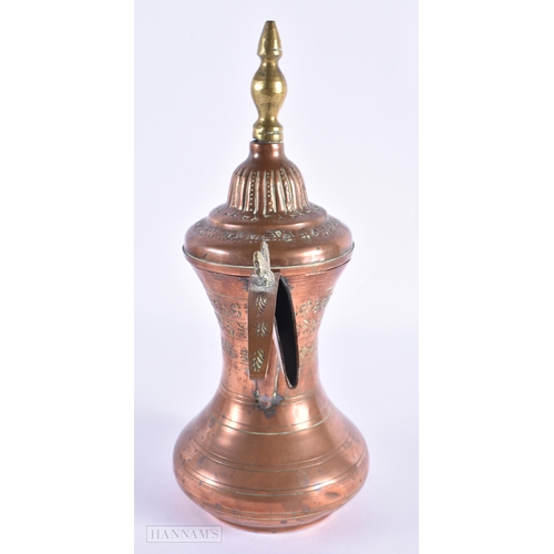 30 - AN OMANI MIDDLE EASTERN COPPER EWER. 26 cm high.