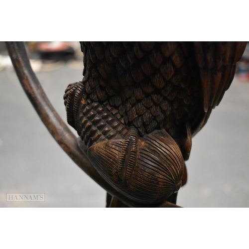 308 - A RARE LARGE EARLY 20TH CENTURY ANGLO INDIAN COUNTRY HOUSE CARVED WOOD PARROT ON A RING naturalistic... 