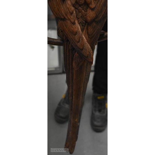 308 - A RARE LARGE EARLY 20TH CENTURY ANGLO INDIAN COUNTRY HOUSE CARVED WOOD PARROT ON A RING naturalistic... 