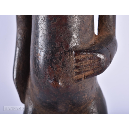 309 - AN ANTIQUE AFRICAN TRIBAL CARVED WOOD FIGURE. 30 cm high.