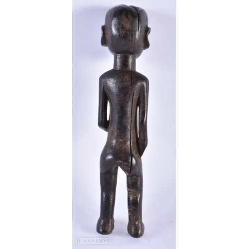 309 - AN ANTIQUE AFRICAN TRIBAL CARVED WOOD FIGURE. 30 cm high.