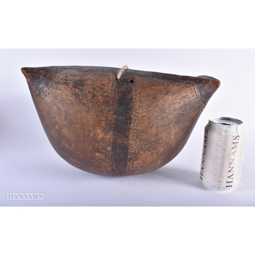 310 - AN AFRICAN TRIBAL CARVED WOOD FOOD BOWL. 32 cm x 20 cm.