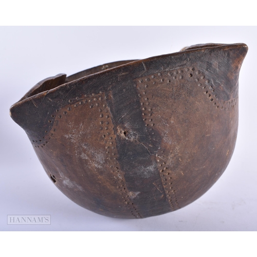 310 - AN AFRICAN TRIBAL CARVED WOOD FOOD BOWL. 32 cm x 20 cm.