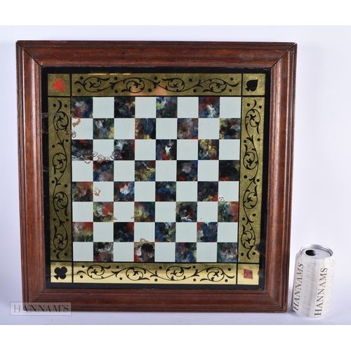 311 - AN ANTIQUE REVERSE PAINTED GLASS GAMING CHESS BOARD. 45cm square.