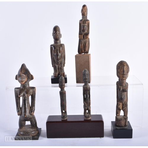 312 - A GROUP OF ANTIQUE AFRICAN TRIBAL CARVED WOOD FIGURES. Largest 15cm high. (5)