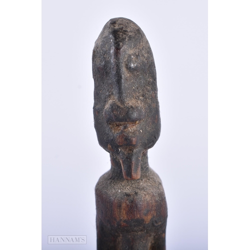 312 - A GROUP OF ANTIQUE AFRICAN TRIBAL CARVED WOOD FIGURES. Largest 15cm high. (5)